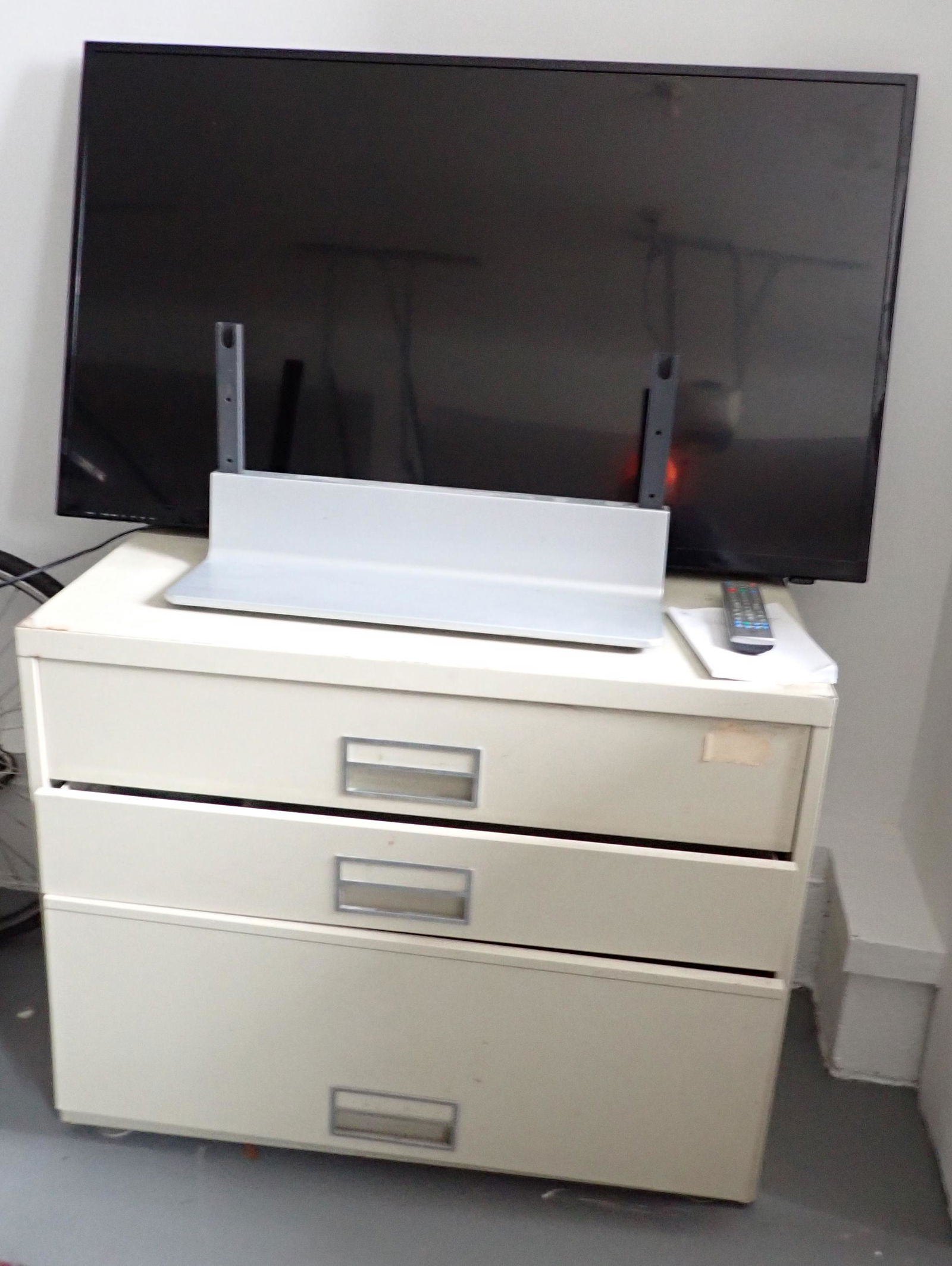 Westinghouse 50" Flat Screen TV & File Cabinet: File cabinet and tv