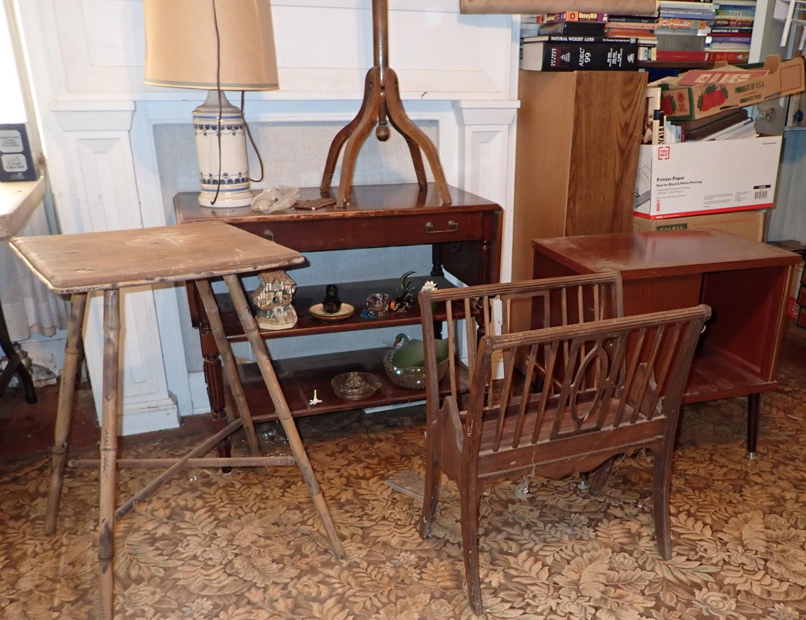 Plant Stands Record Cabinet & Misc: Lot includes plant stands, magazine rack ( damaged ) , Server w/ damaged gkassware& misc on shelves , record cabinet, and lamp on server. Does not include print on wall, or shelf and all books in back