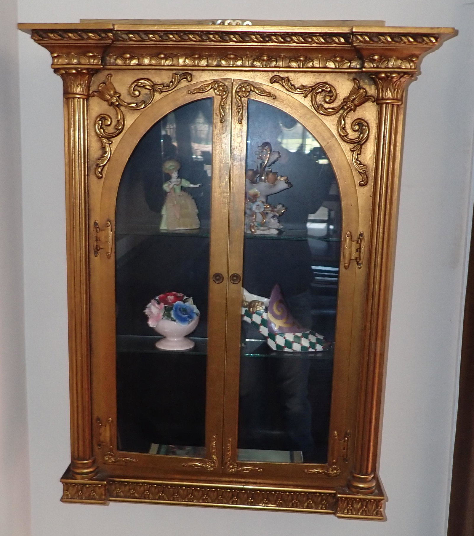 Curio Cabinet and Contents: Cabinet is approx 8" x 28 1/2" x 35 1/4" tall. Buyer must remove from wall
