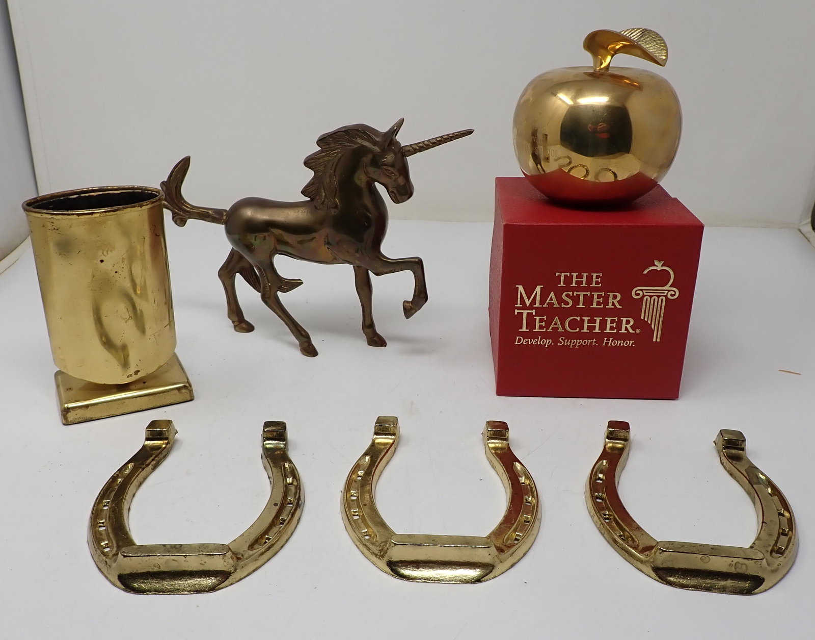 Brass Unicorn Horseshoes Apple Pen Holder: Unicorn is approx 8 1/2" long and 6 3/8" tall. Horseshoes are light brass