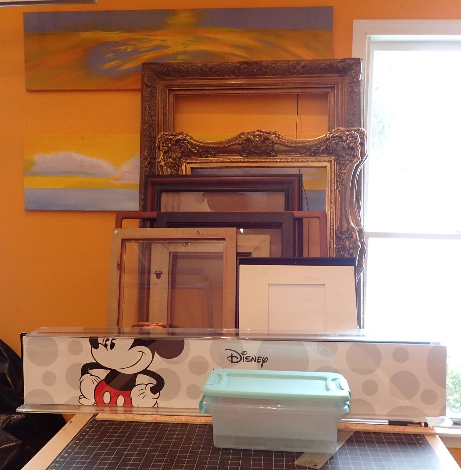 2 Gold Gilt Picture Frames and Misc: Lot includes everything pictured on workbench and 2 painting on wall. Gold gilt frames are wood. Largest is approx 32 1/2" x 45 3/4"