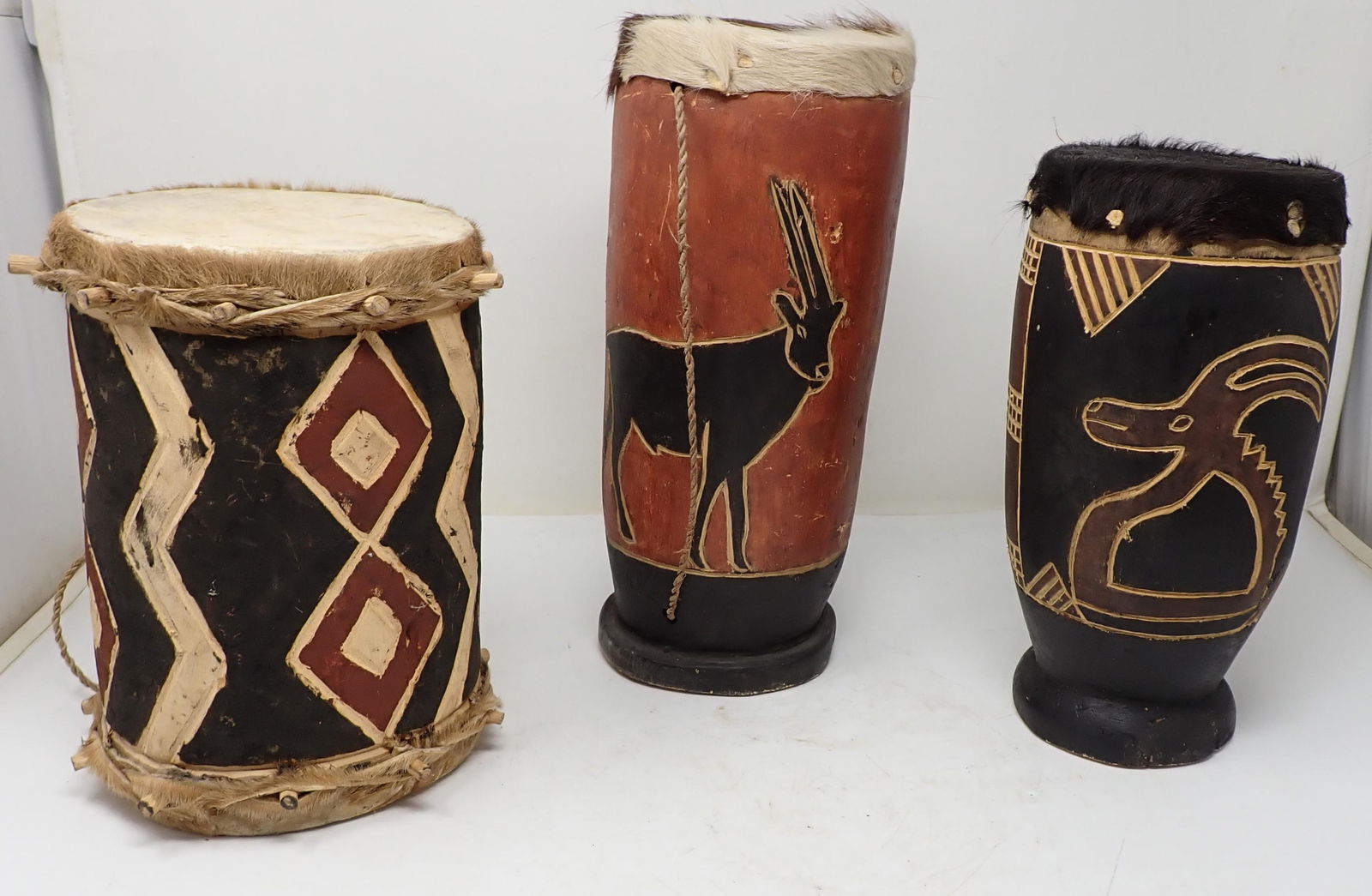 Hand Made and Carved Drums: Tallest is approx 4 7/8" in diameter and 11 1/2" tall