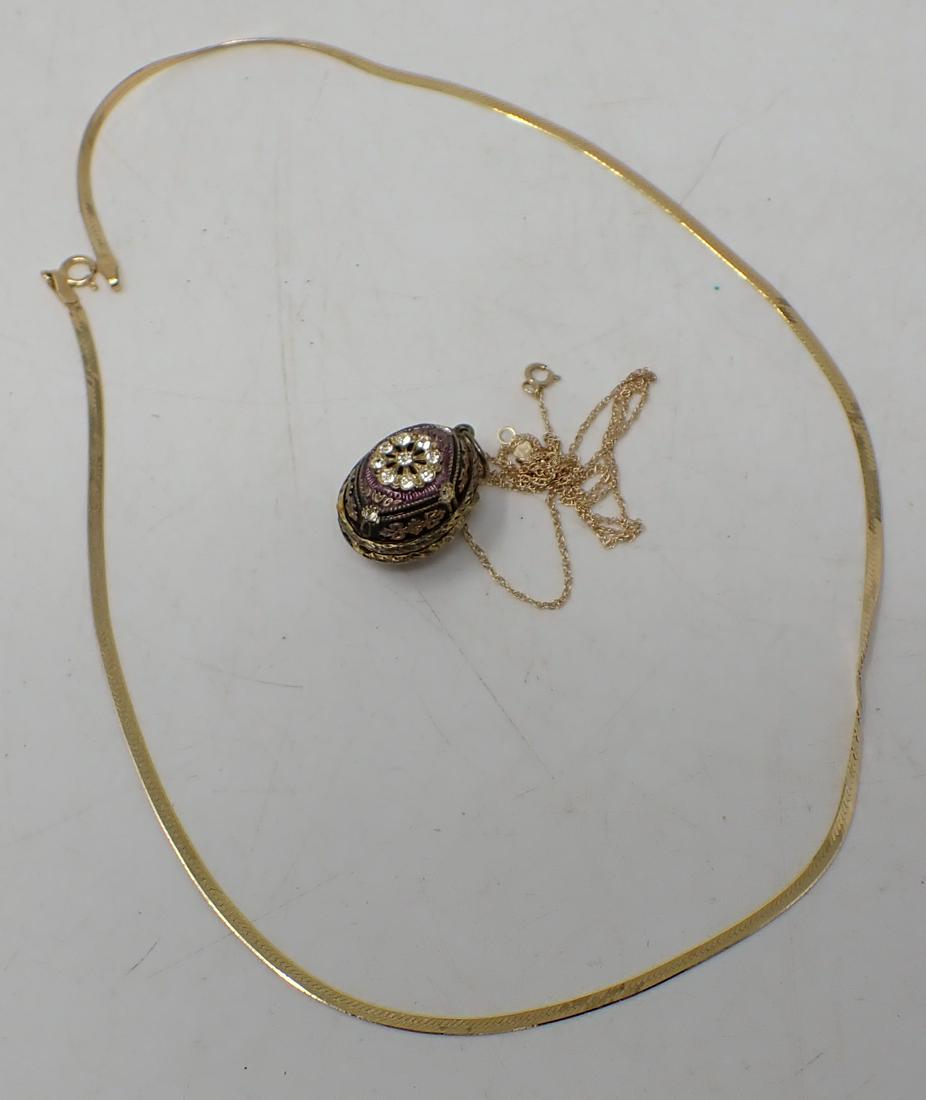 14Kt Gold Ring & Chains w/ Squirrel in Egg Charm: Charm is not gold. Total weight INCLUDING charm is approx 15.95 grams. Weight is approximate and not guaranteed.