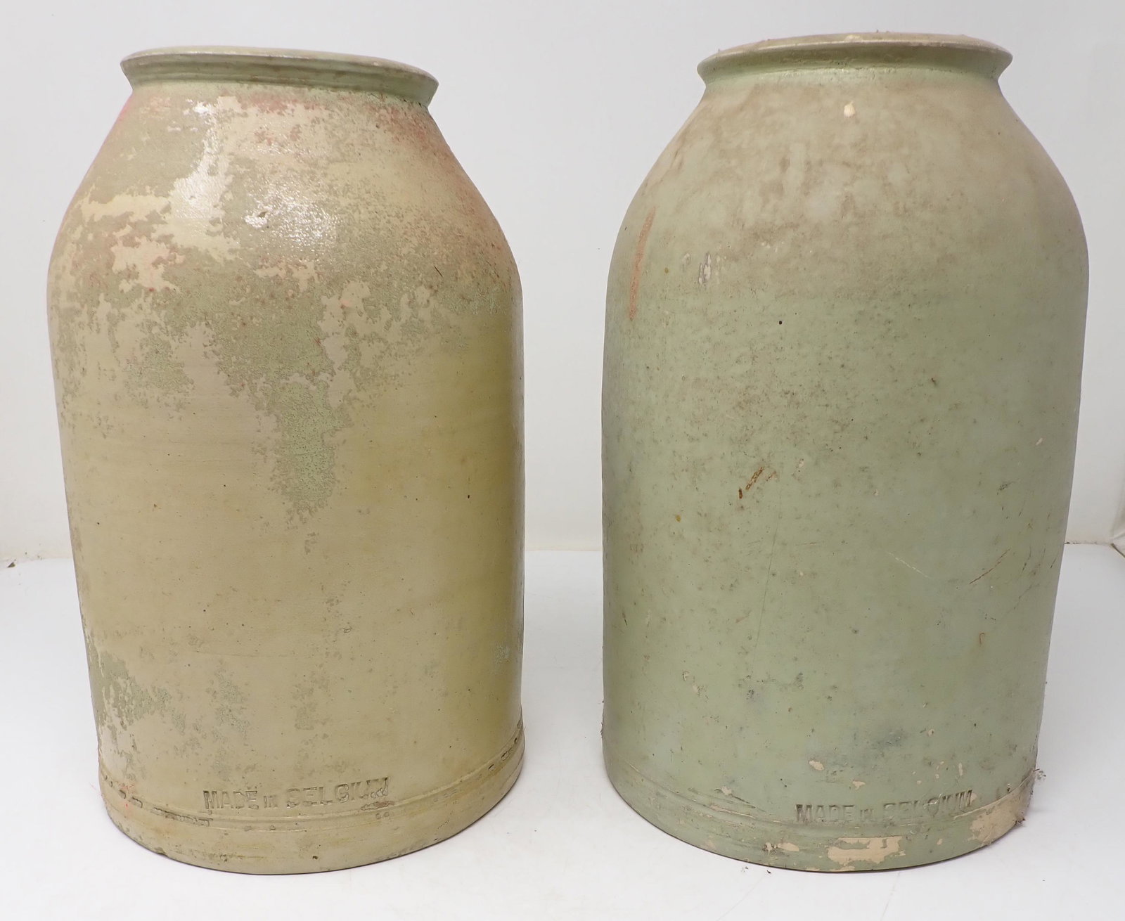 2 Belgium Stoneware Crocks / Preserve Jars: Approx 6 7/8" in diameter and 11 3/8" tall. One on right has a lot of paint on it. Left one , mostly flaked off
