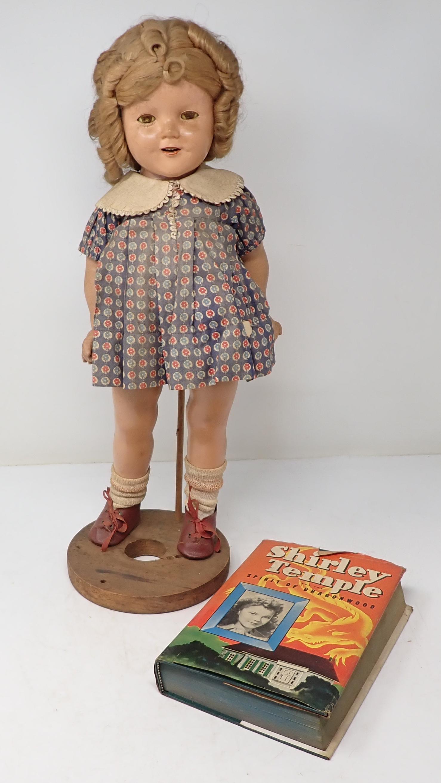 Ideal Shirley Temple Doll & Book: Apprx 18" . All dolls in this sale are from an estate of a doll collector and repair shop. If we notice it is repaired, we will mention it. We do not take clothes off and inspect bodies. All are sold