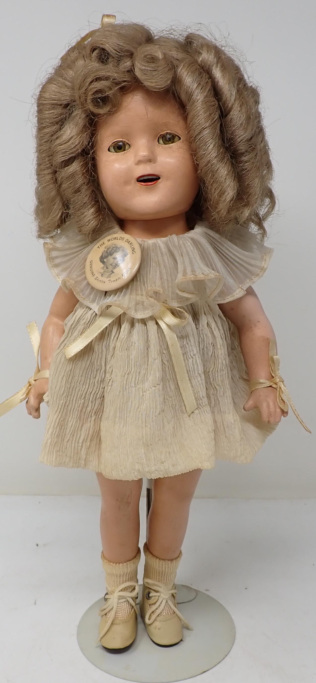 Ideal Shirley Temple Doll: Approx 15 1/2" All dolls in this sale are from an estate of a doll collector and repair shop. If we notice it is repaired, we will mention it. We do not take clothes off and inspect bodies. All are so