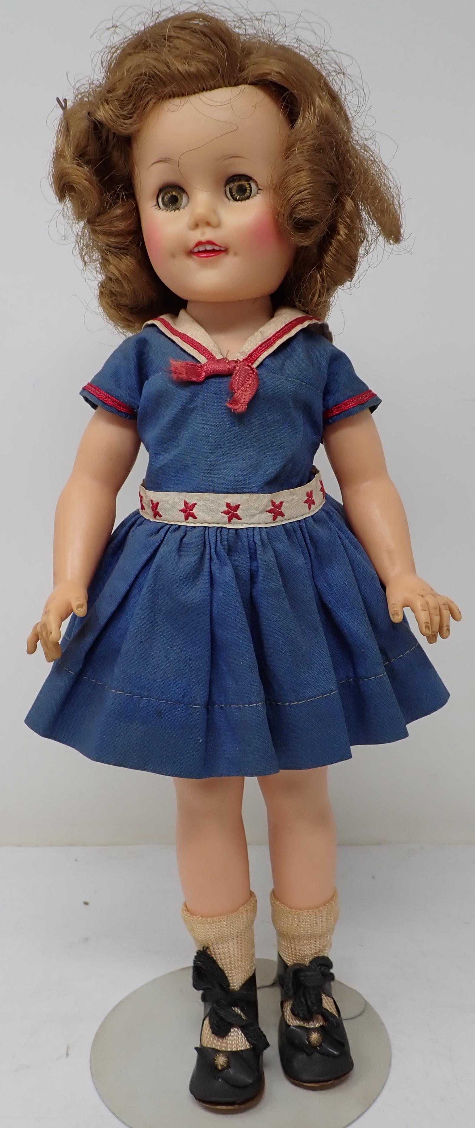 Ideal ST-15 Shirley Temple Doll: Approx 15". All dolls in this sale are from an estate of a doll collector and repair shop. If we notice it is repaired, we will mention it. We do not take clothes off and inspect bodies. All are sold