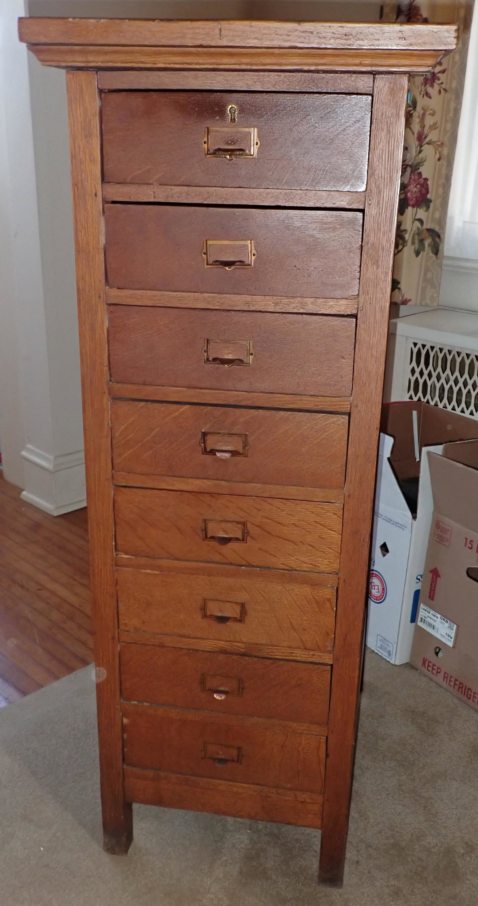 Oak File Cabinet: Approx 18" x 23 1/8" x 47 1/2" tall. Top is on slight angle, like it was used for a podium.