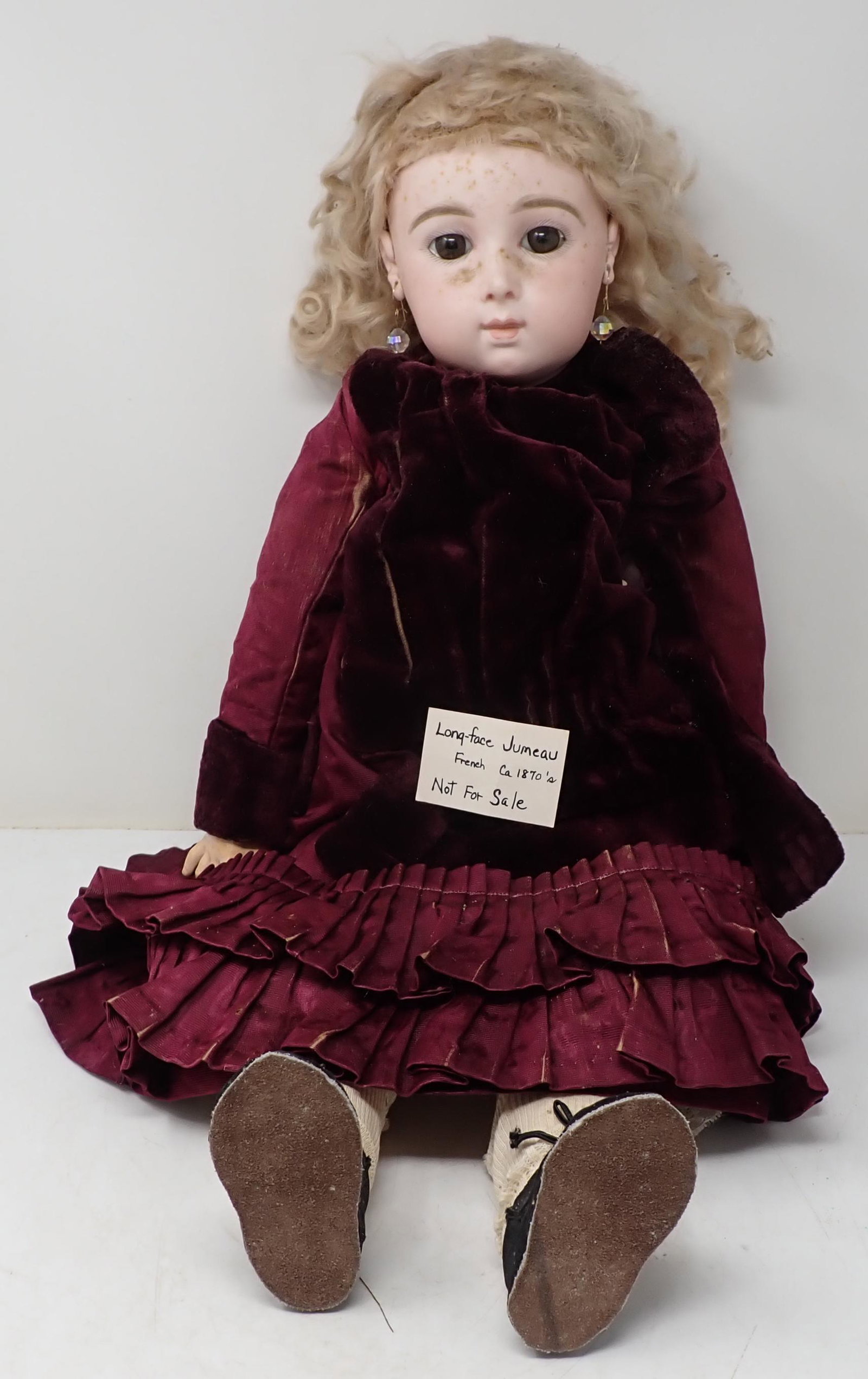 Jumeau 24" Bisque Head Doll Fixed Eyes Pierced Ears: This is a long faced doll, she would not sell from her collection. Apprx 24". Has fixed eyes, pierced ears, Jointed body. Marked 11 on back of neck. She has dust on her face. We do not clean anything 