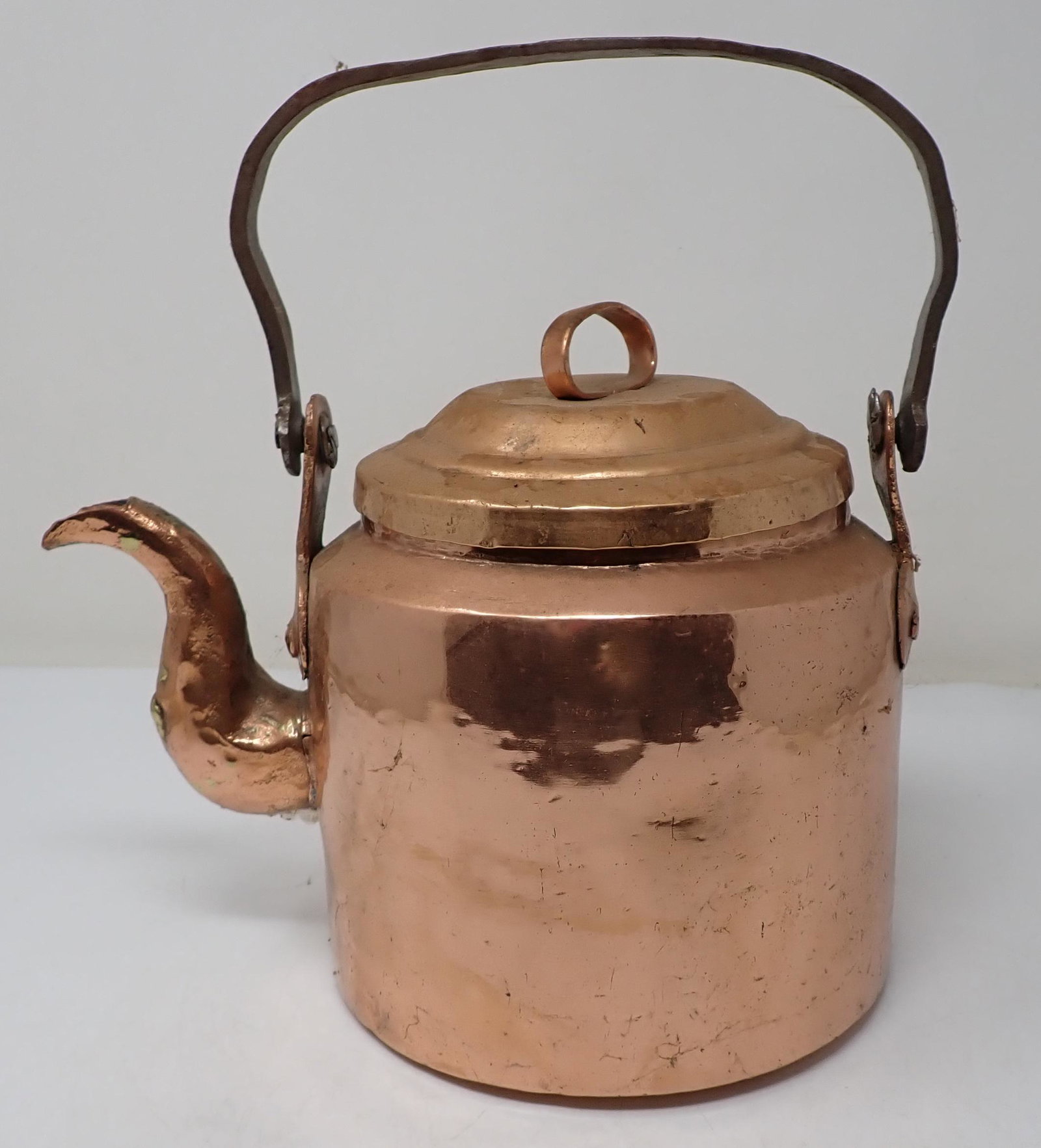 Dove Tailed Copper Teapot: Apprx 8 1/4" tall. Has wrought iron handle