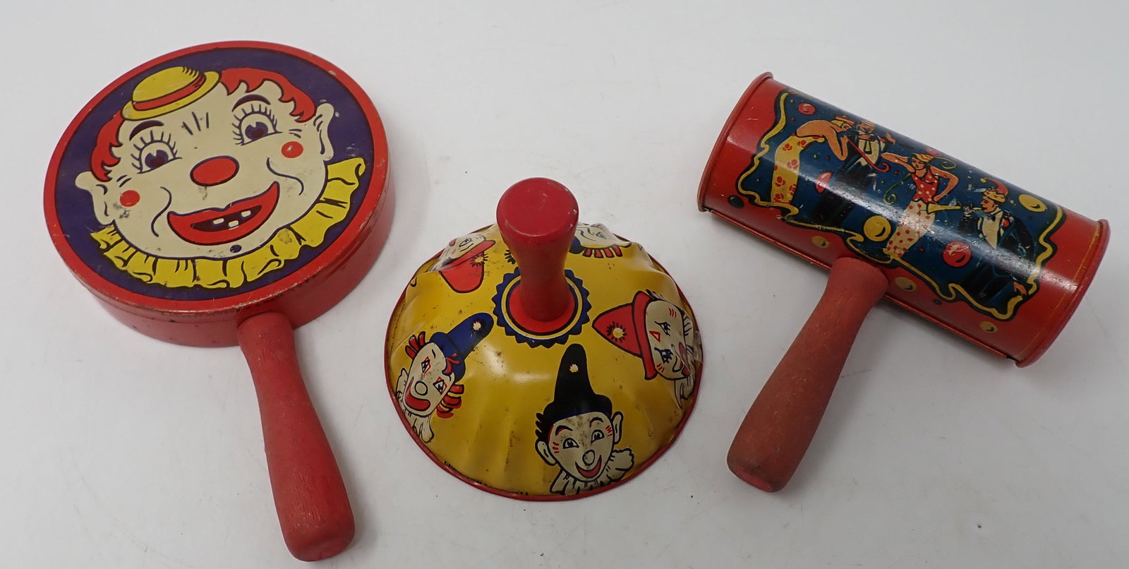 Tin Clown Noisemakers: One on left is apprx 4" in diameter and 6 3/4" long