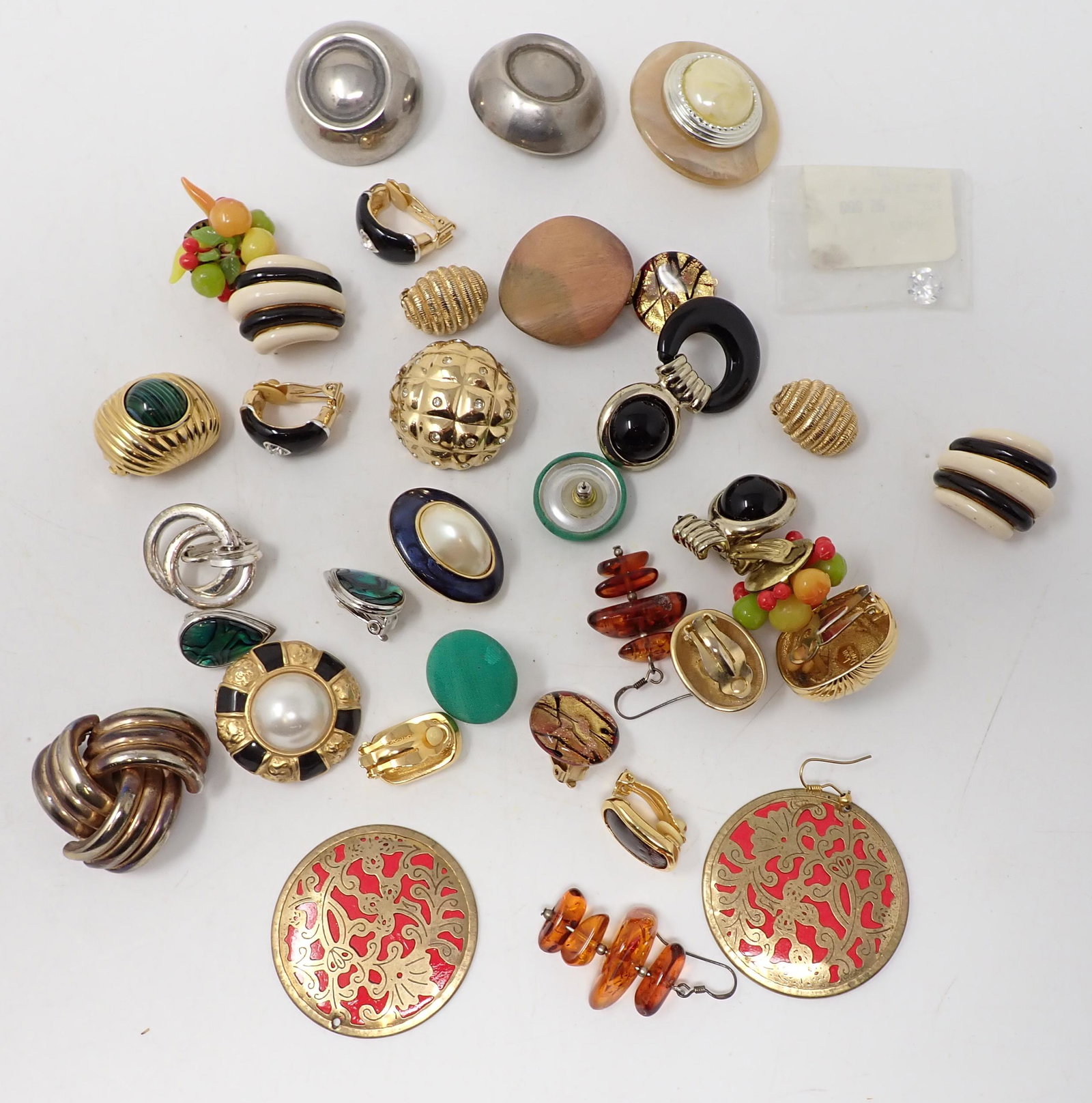Costume Earrings: 12 Pairs of various styles including gold-tone, foil glass; fruit motif; amber; etc. Includes some miss-matches