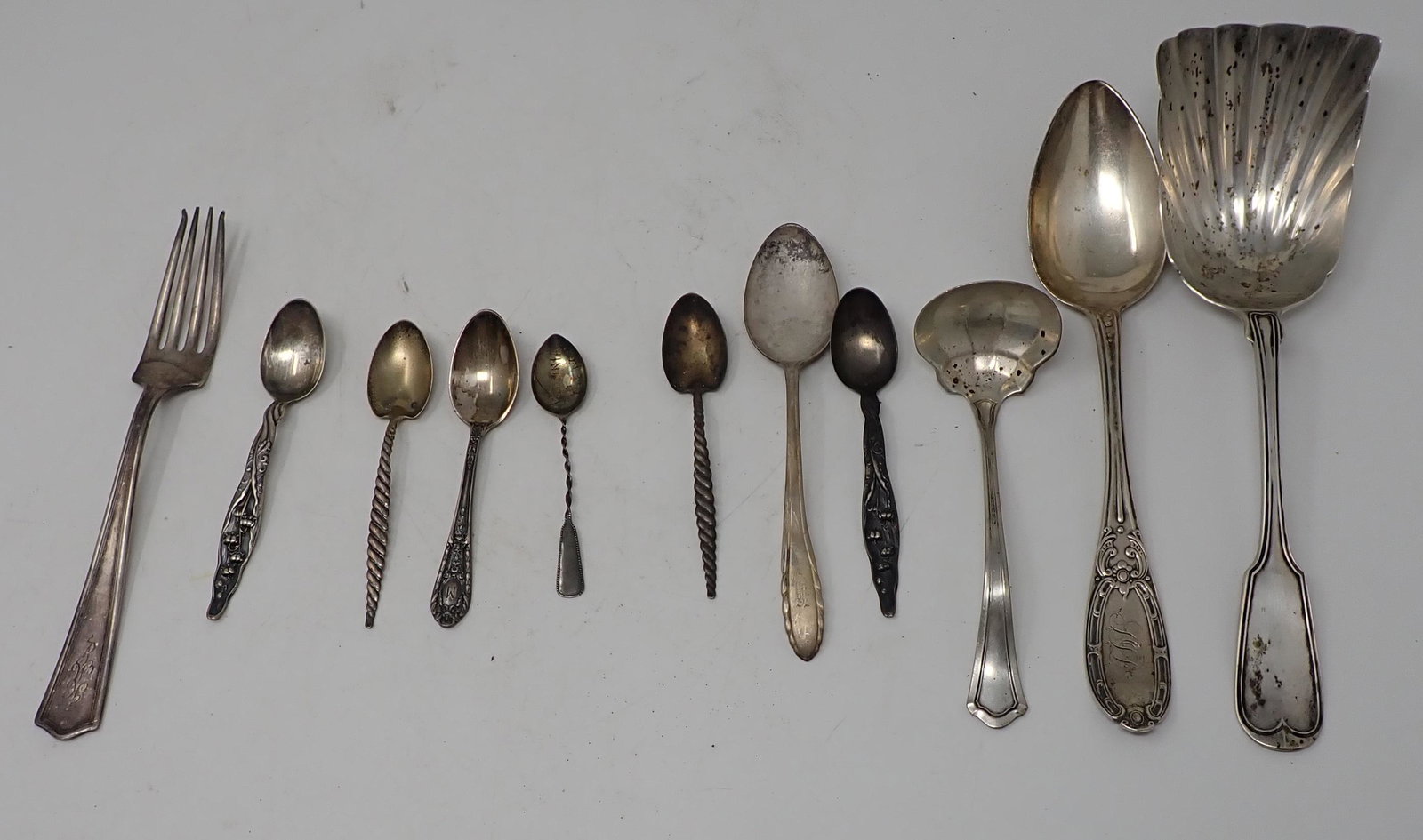 Silver Spoons Forks & Serving Pieces: All are marked Sterling except the 2 pieces on the right. The two pieces on the right tested silver. Total weight is approx 280 grams.