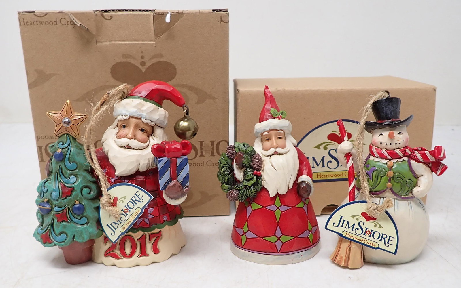 Jim Shore Santa and Snowman Figurines: Tallest is apprx 4" . Box for snmowmen is not the right box