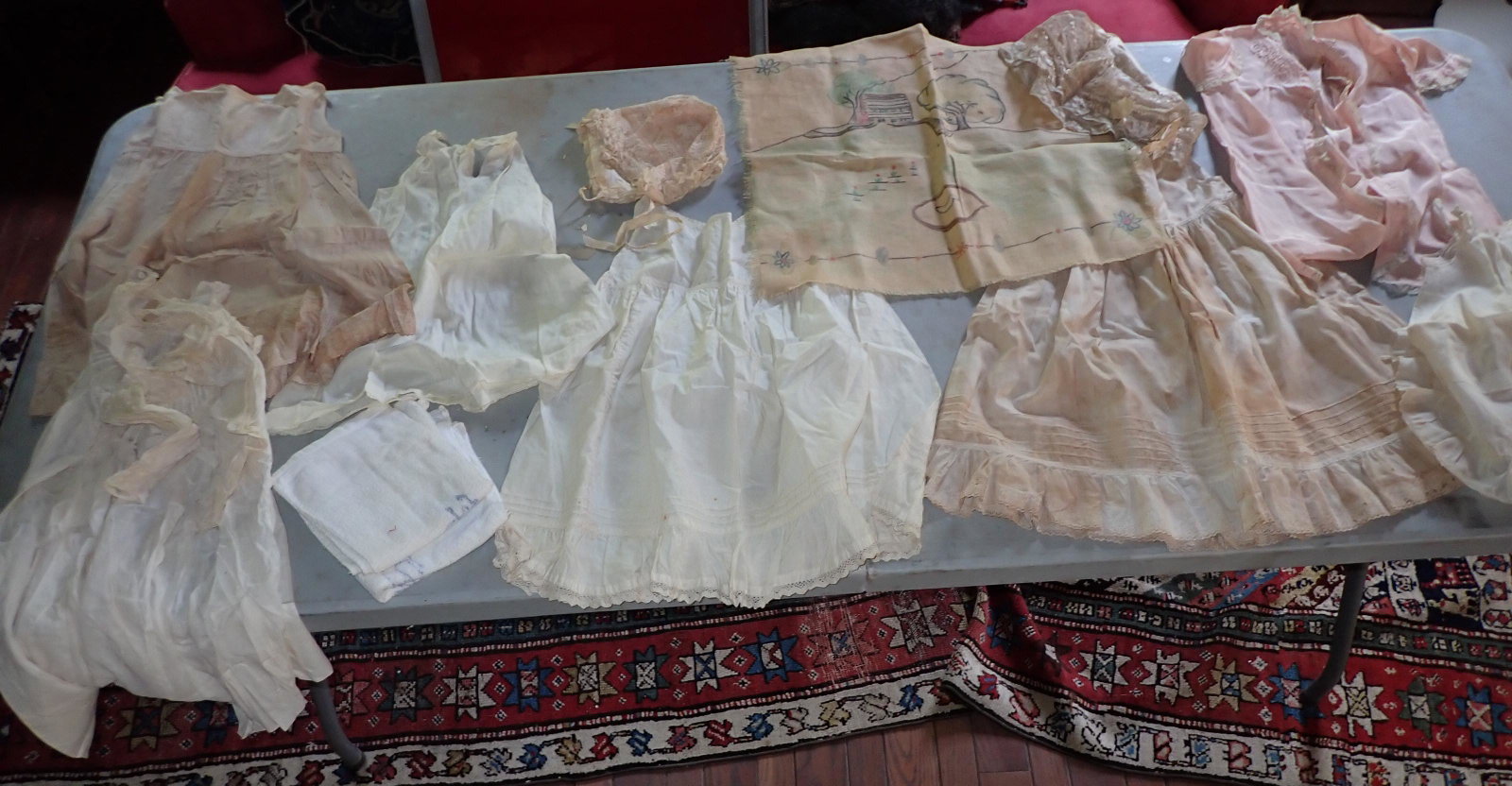 Antique Childrens Clothing & Bonnets: Getting all on table.