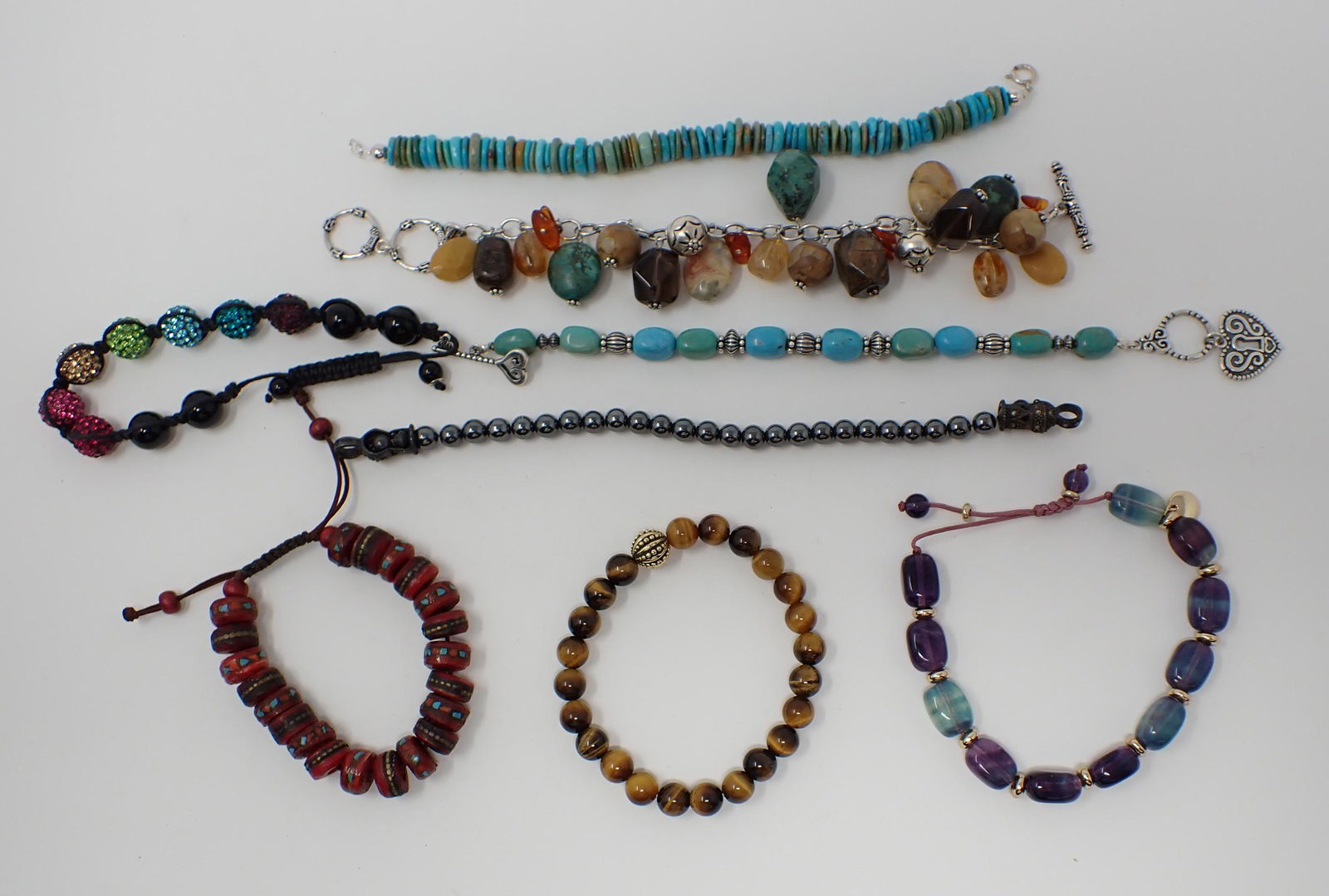 8 Beaded Bracelets: Includes turquoise, rhinestones and more, some silver findings.