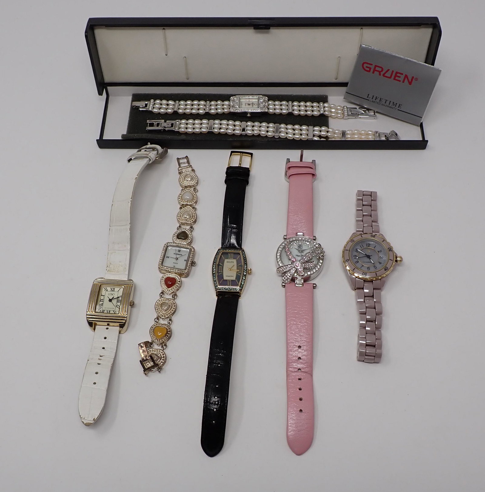 6 Lady's Fashion Wrist Watches: Including one Gruen with matiching pearl bracelet; Ecclissi; Silverwear; Victoria Wieck; Isaac Mizrahi; and Lori Goldstein.