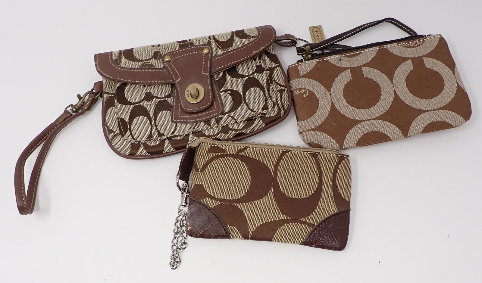 Coach Handbags: Largest is approx 5" x 7 1/2". These are from an estate and Authenticity is not guaranteed.