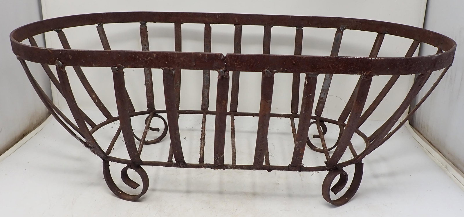 Iron Planter / Log Holder: Approx 13" x 24" x 8 1/2" tall.