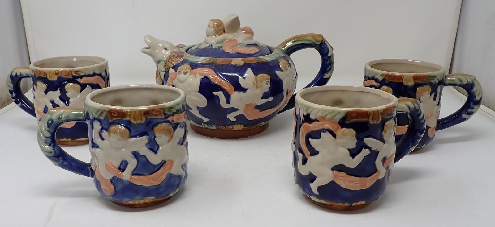 Henriksen Imports Tea Set: Cups are approx 4 1/2" in diameter and 4" tall.