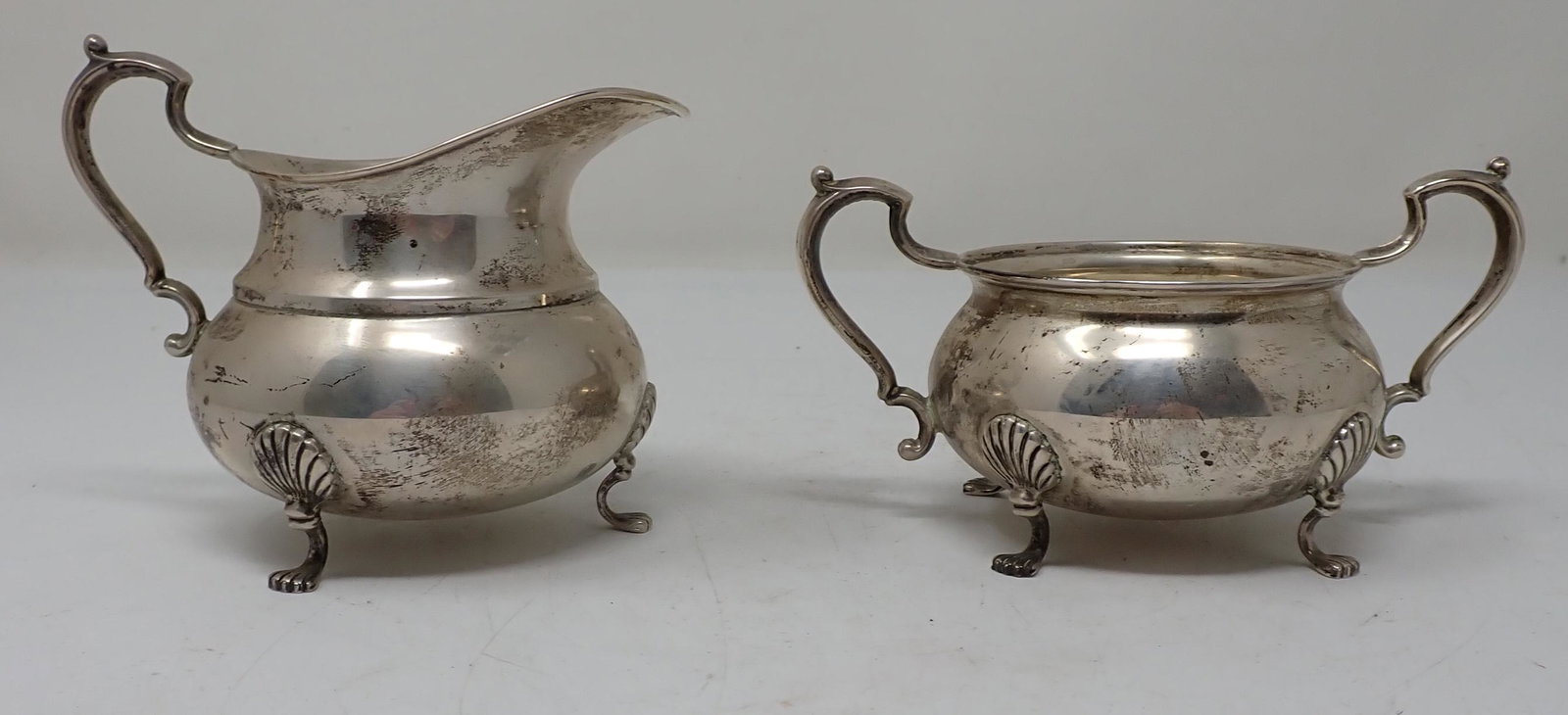 Fisher Sterling Silver Creamer & Sugar: Numbered 779. Creamer is approx 3 5/8" tall. Total weight is approx 155 grams