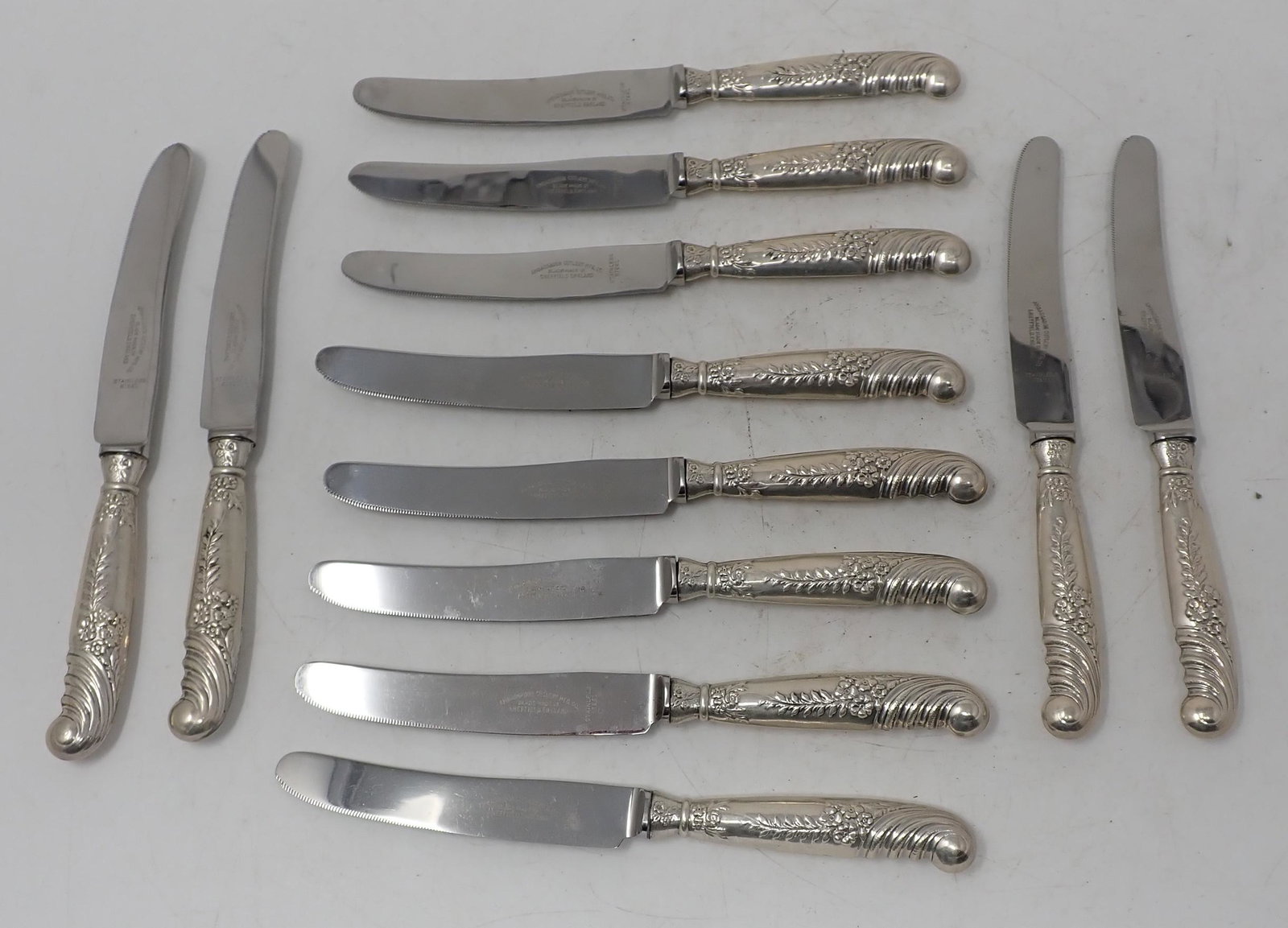 Ambassador Cutlery Knives: Sterling silver handles. Total length is approx 7 1/8" long. Total weight is approx 375 grams