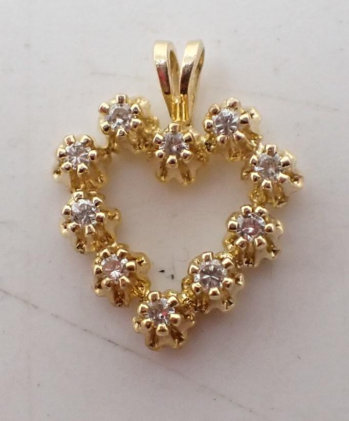 14K Gold Heart Charm: Approx 1/2" long and total weight is approx 0.48dwt