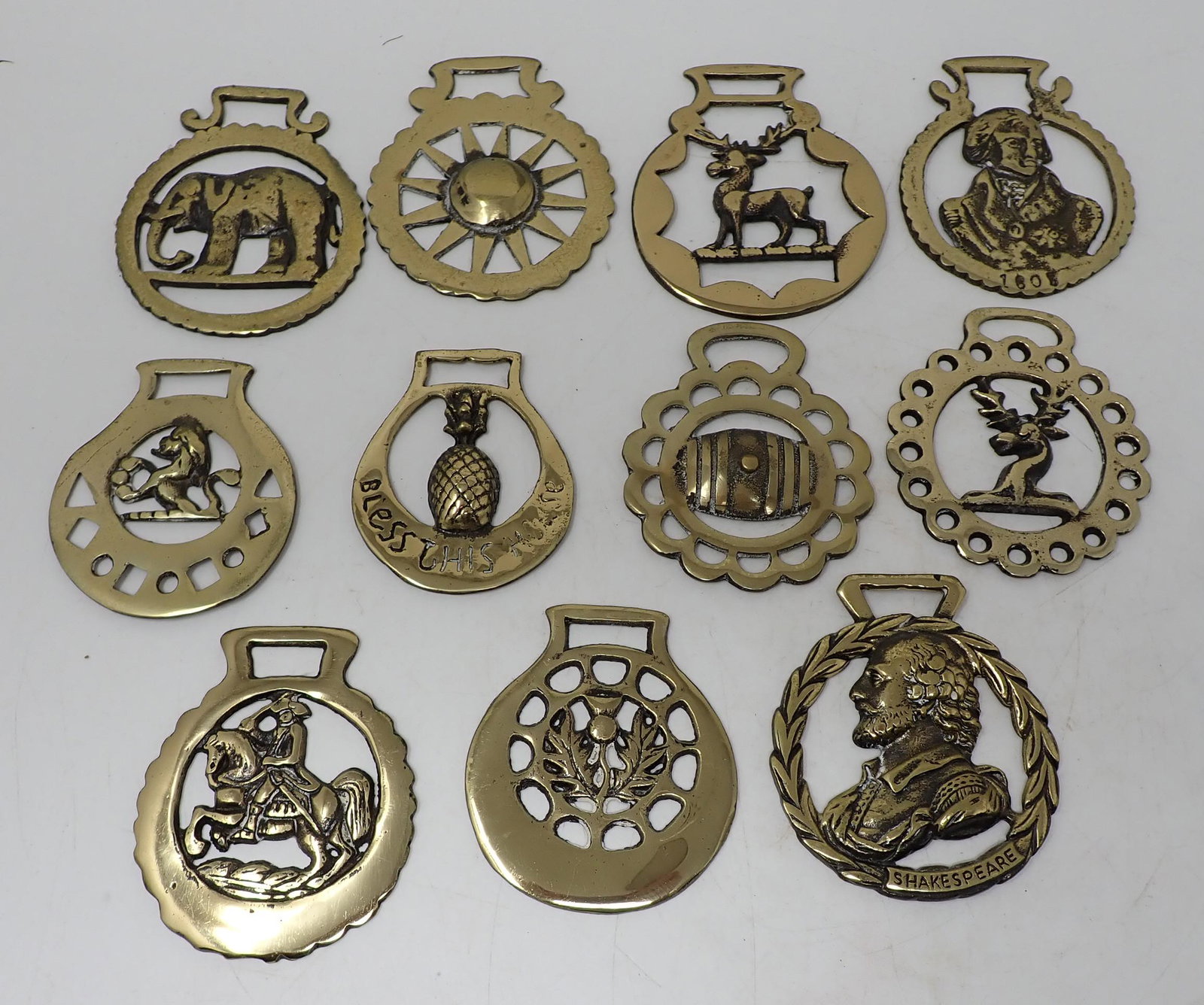 Brass Plaques / Bottle Openers ?: Largest is approx 3 1/4" in diameter