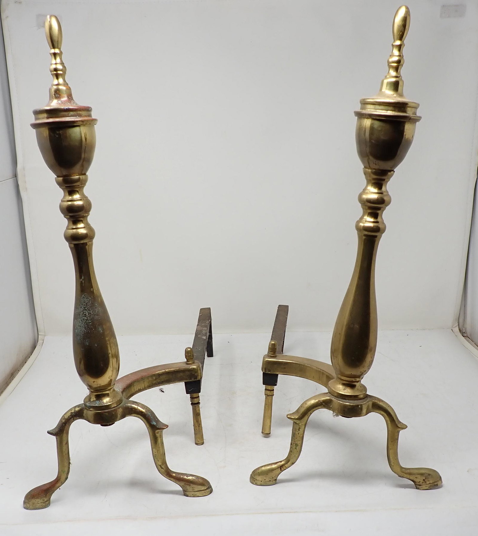 Brass Andirons: Approx 8" wide, 16 3/4" deep, and 18" tall.