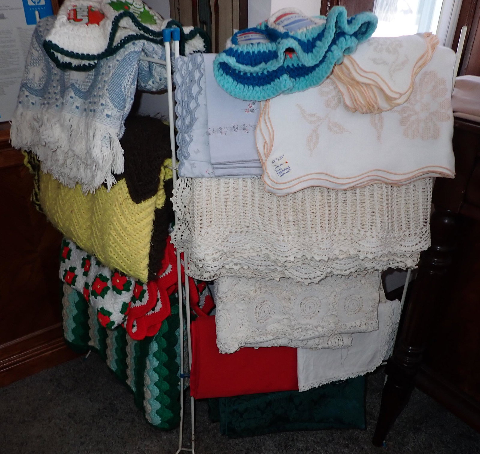 Tablecloths Blankets & Rack: Lot includes rack and contents. We will ship contents, but not rack