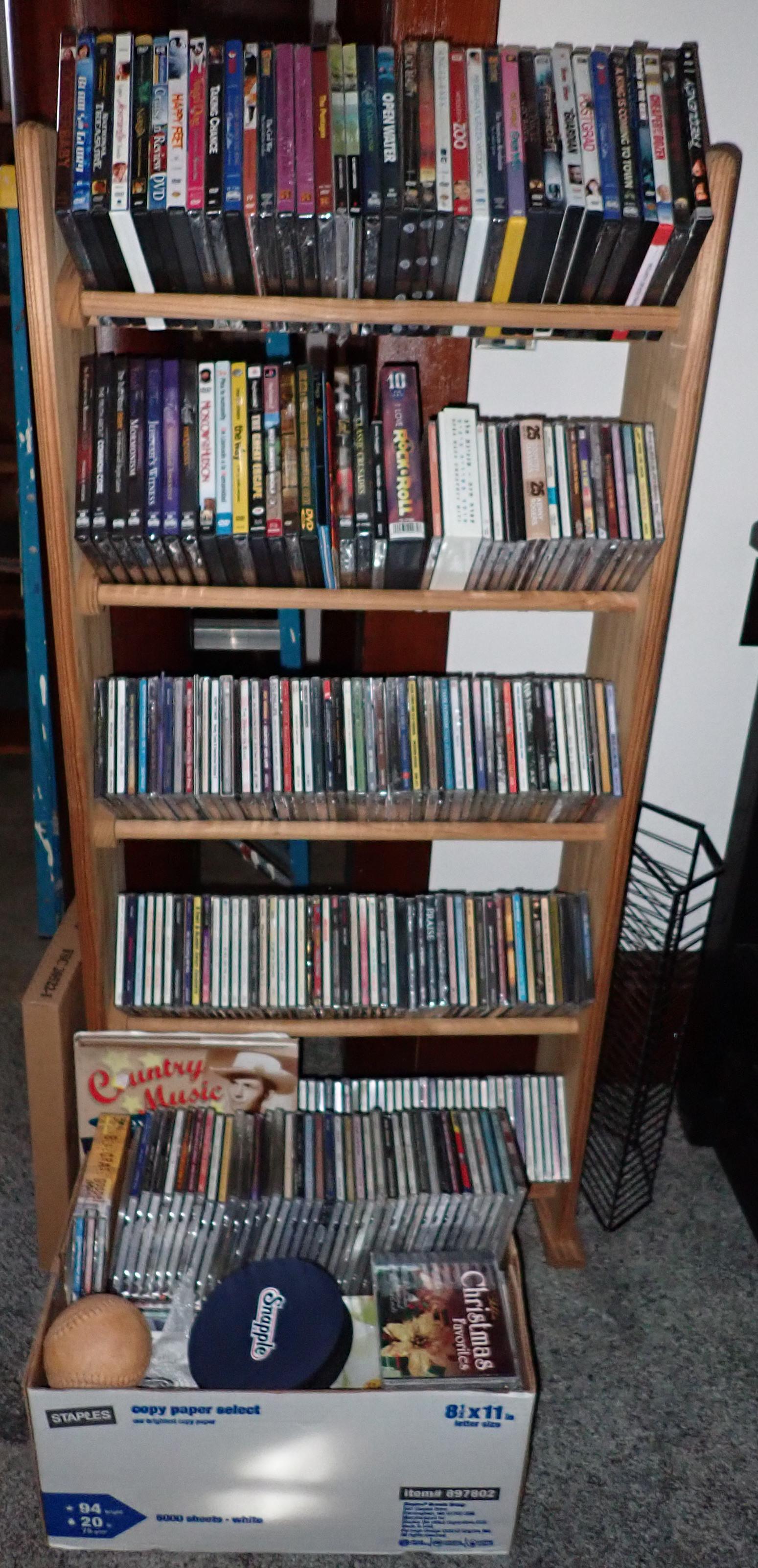 Cd's DVD's and Rack: We do not guarantee correct disc is in correct sleeve or if all are full. Sold as pictured. NO SHIPPING !