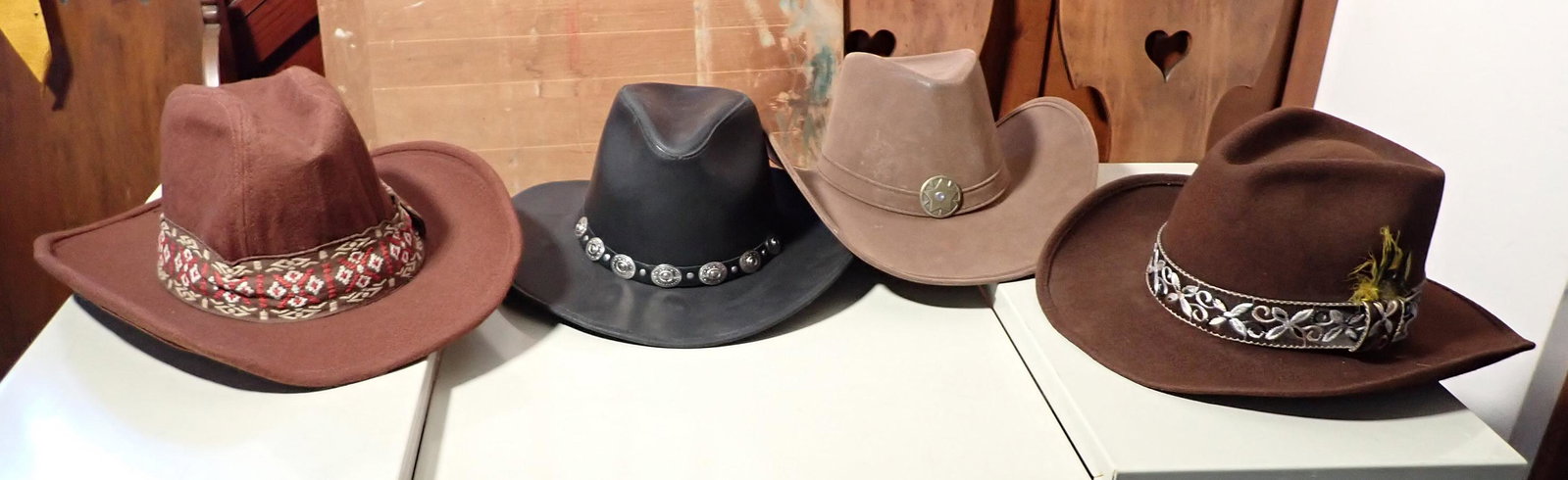 Cowboy Hats incl Leather: One second from left is leather and is a Large. Left one is large and far right one is 7 3/8"