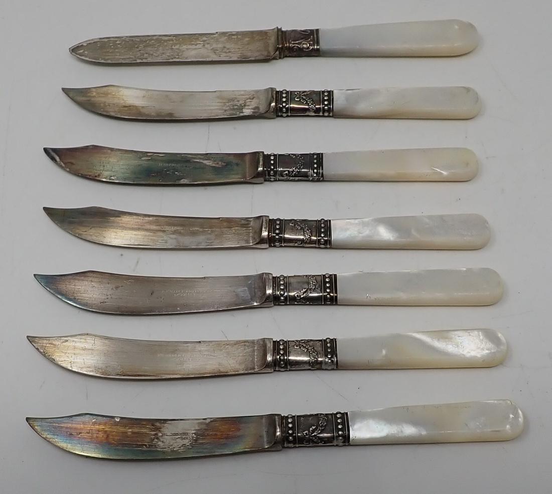 Meriden Cutlery Knives Mother of Pearl Handles: Sterling silver bands. Knife in back is not like the others. Apprx 5 7/8" long