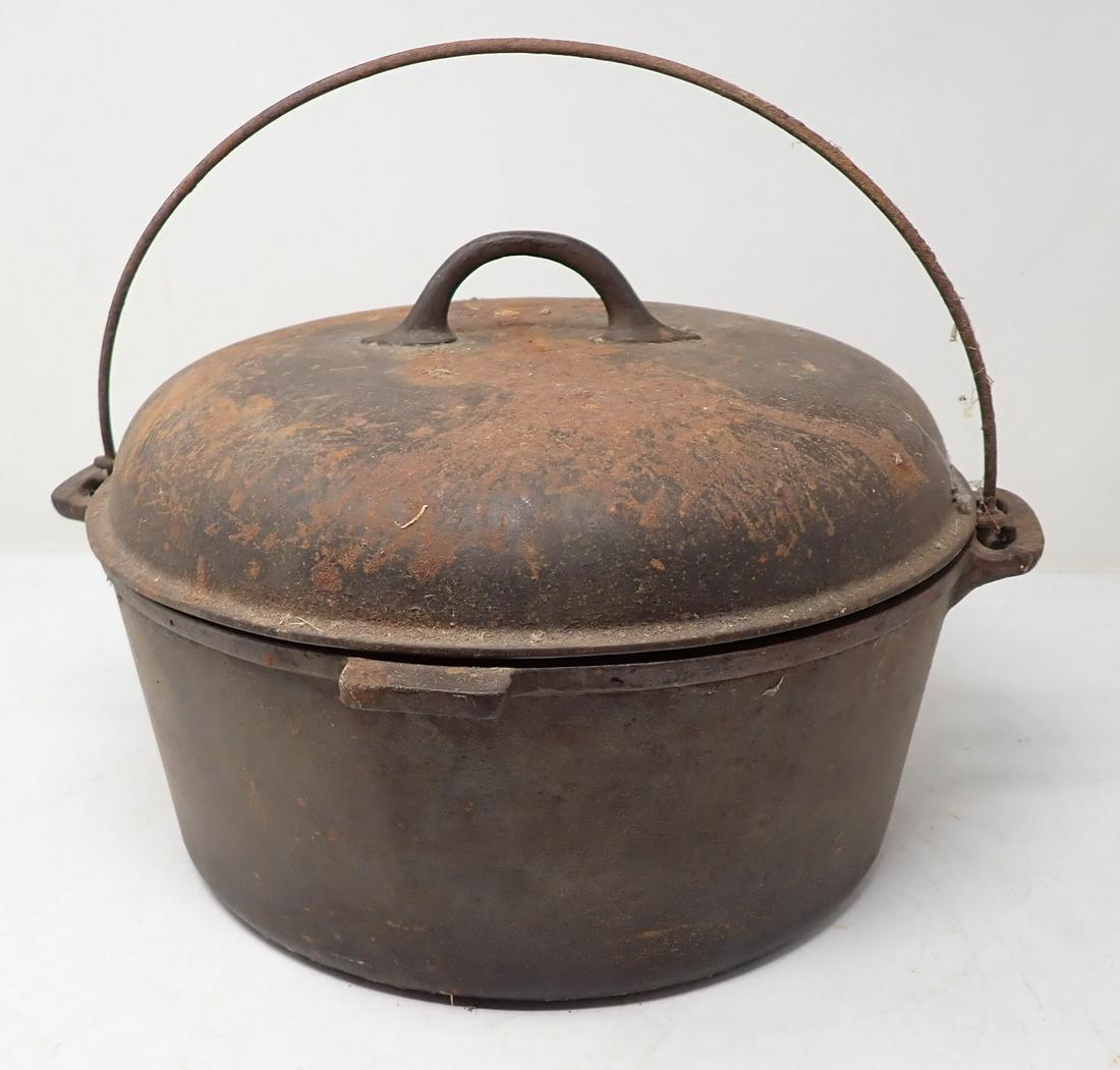 Cast Iron Dutch Oven: Approx 12" in diameter and 8 1/2" tall. Bottom marked 10 and lid is marked 10E