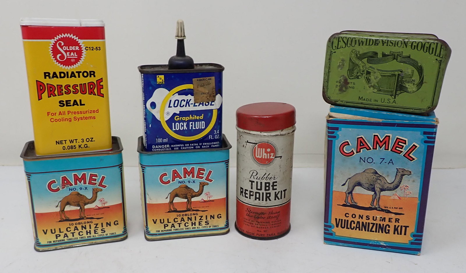 Camel Cescowide Goggles Whiz Tins: Camel on far right is not a tin. 2 Camel tins on left are approx 2" x 3" x 3 1/8" tall