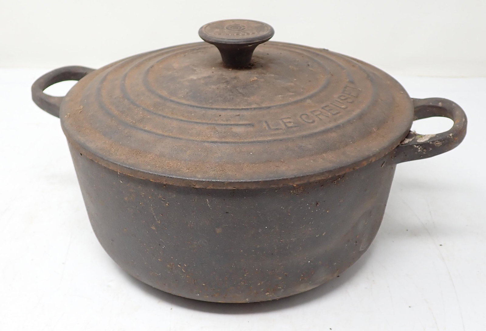 Cast Iron Le Creuset Dutch Oven: Approx 8" in diameter and 6 1/2" tall. Bottom and top are marked with a 20.