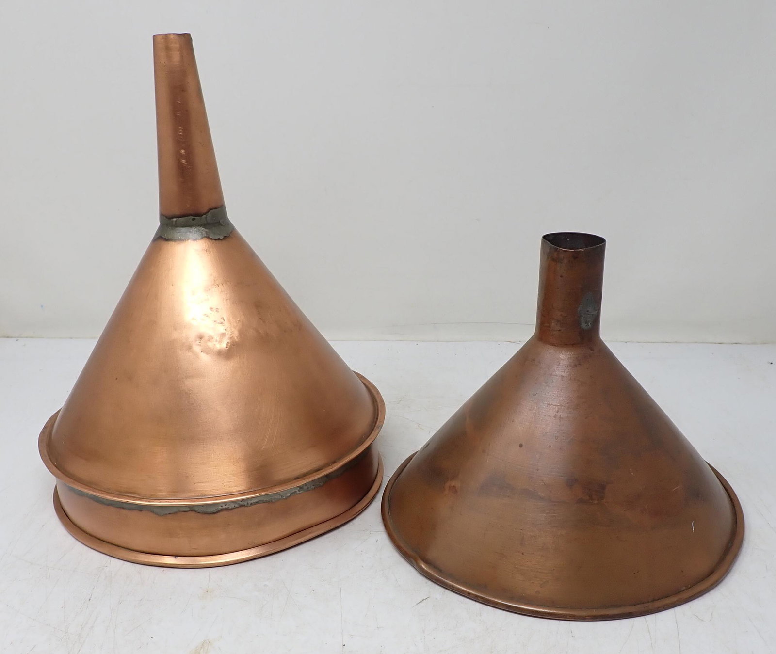2 Copper Funnels: Largest is approx 8 1/4" in diameter and 10" long