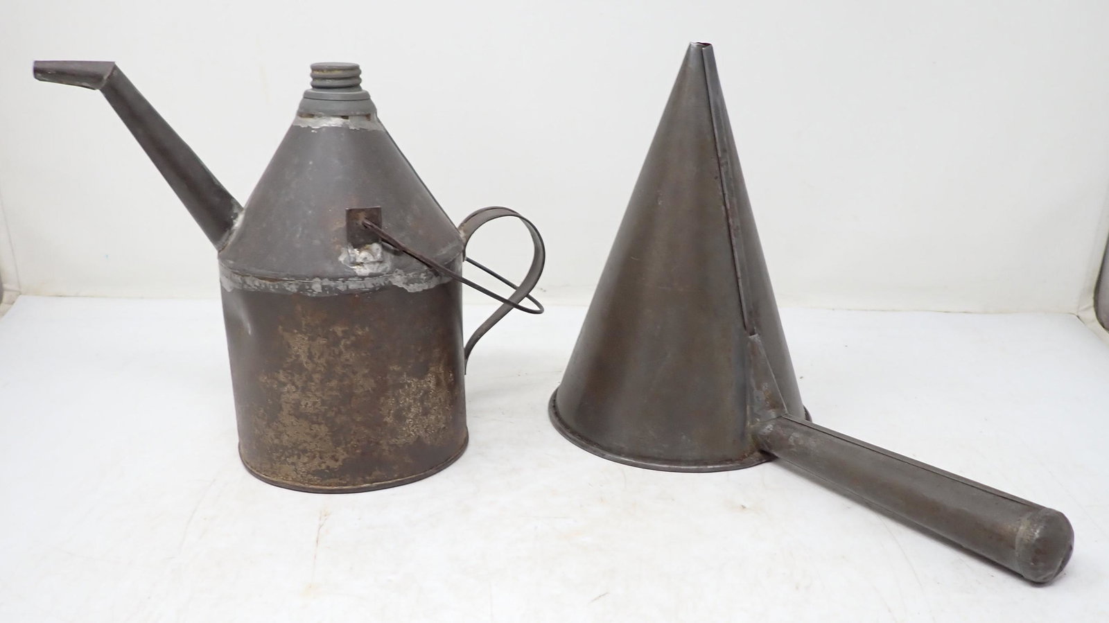 Tin Oil Can & Funnel: Oil can is approx 4 1/2" in diameter and 8" tall
