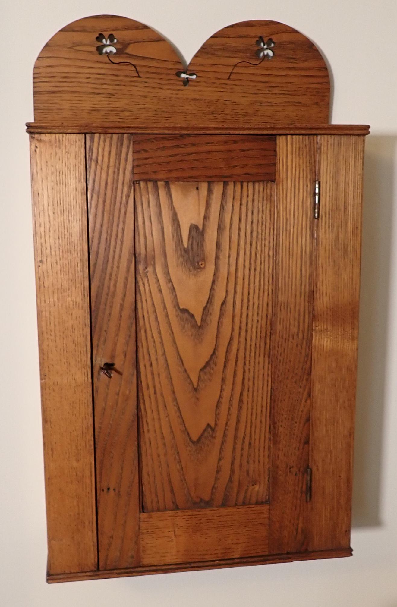 Oak Cabinet w/ Clover Cut Outs: Approx 6 1/2" x 16 1/2" x 29" tall. Bring Screwdriver to remove from wall
