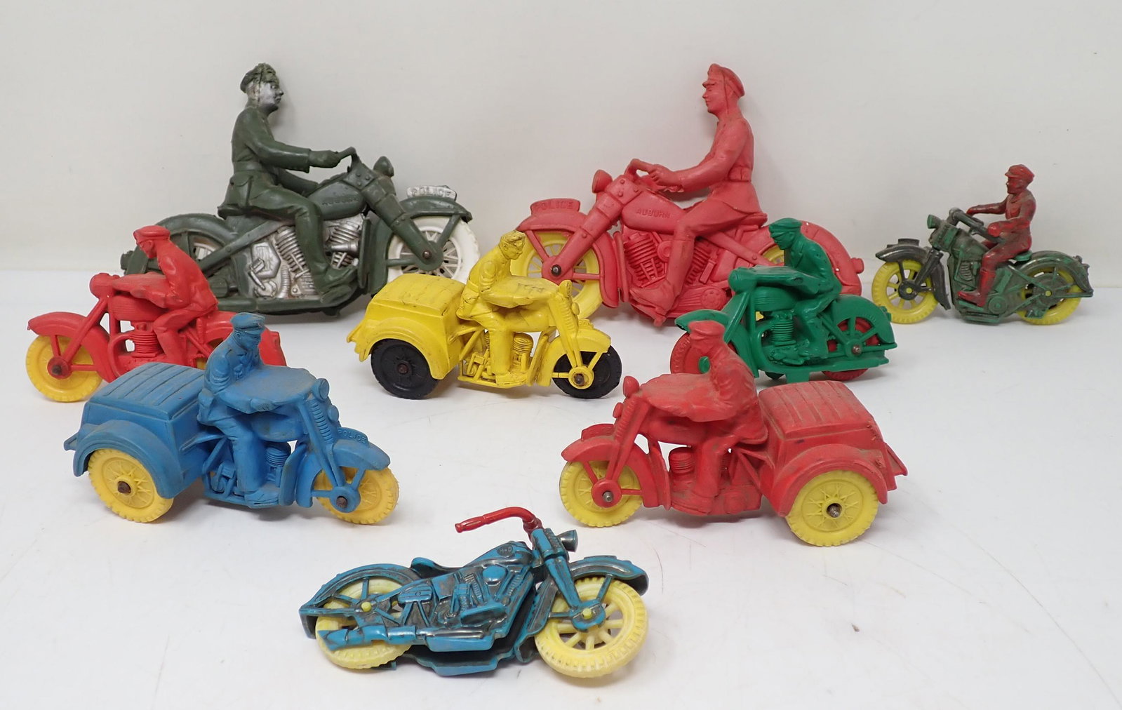 Rubber Motorcycle Toys incl Auburn: Largest are apprx 6". One in front and back right are plastic.