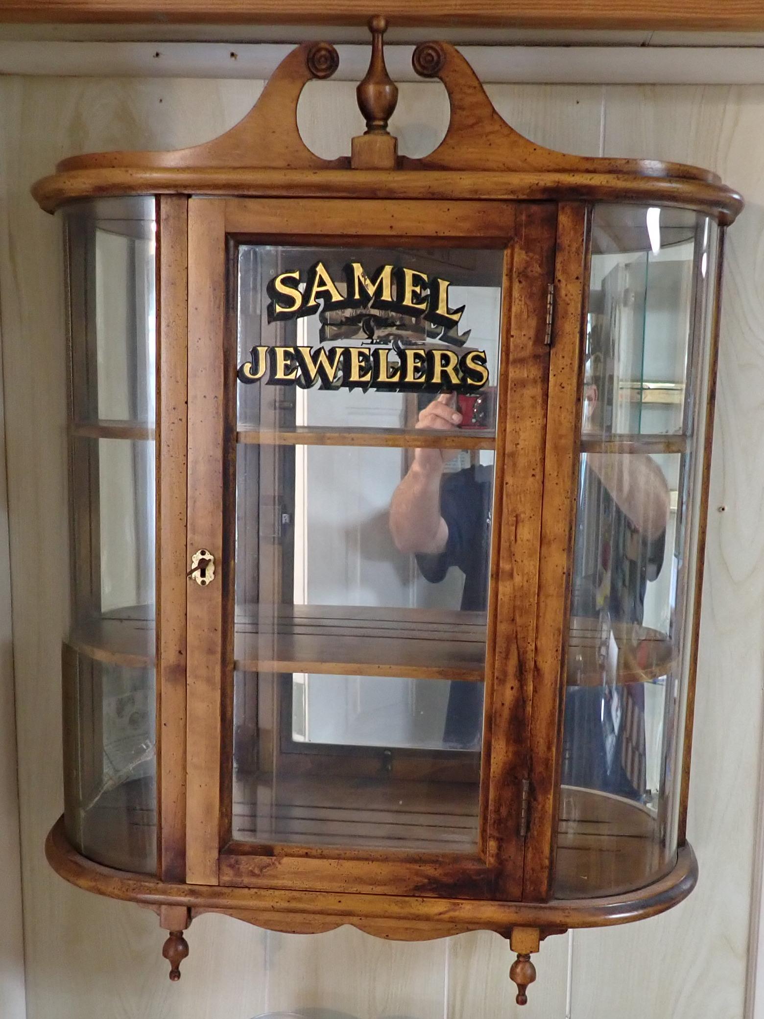 Samel Jewelers Hanging Display / Curio Cabinet: Approx 5 1/2" x 20 1/2" x 27" tall. Buyer to bring phillips head screwdriver to remove from wall.