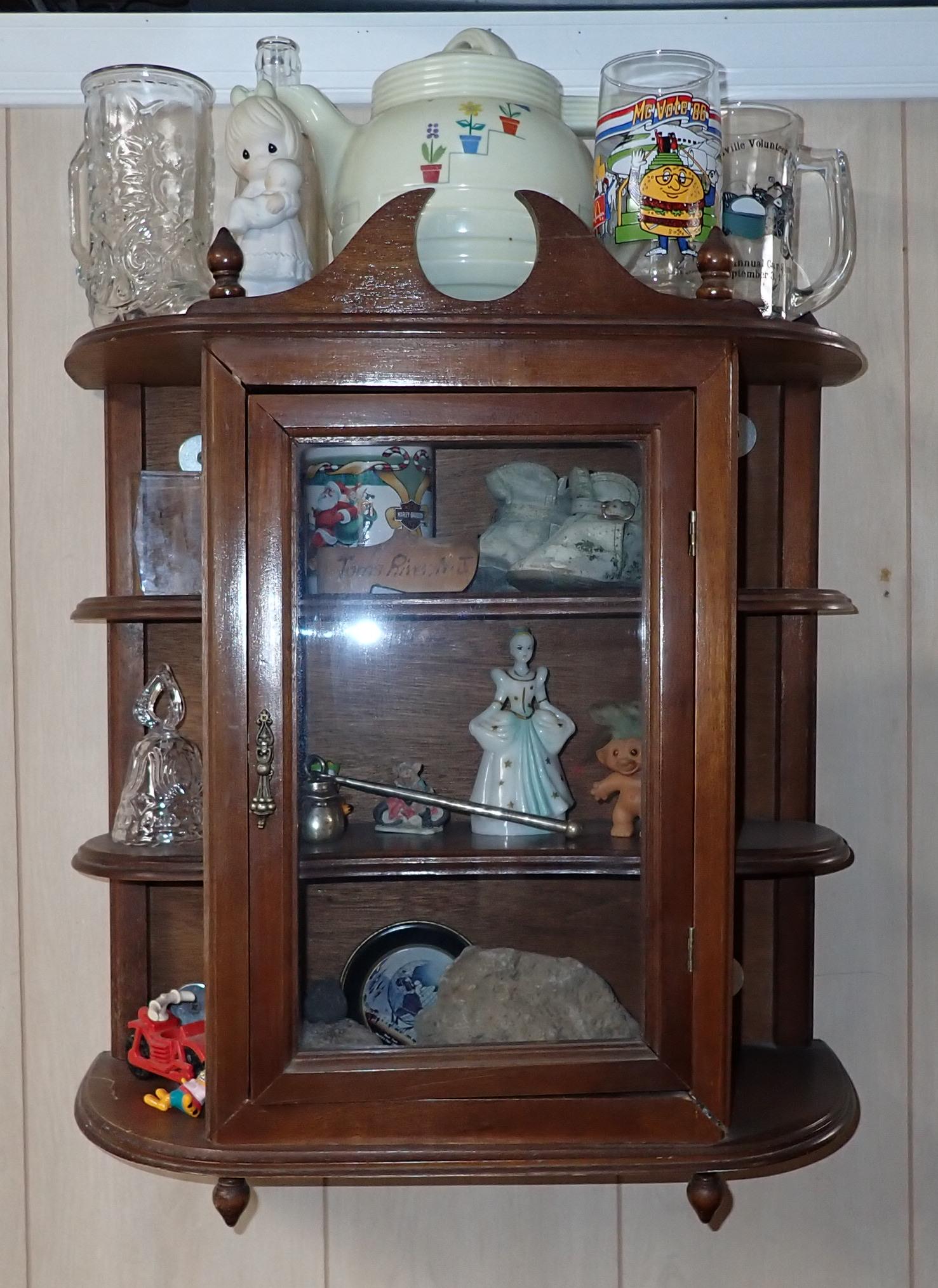 Hanging Curio Cabinet and Contents: Cabinet is approx 8" x 19 1/2" x 23" tall. No shipping ! Buyer to bring phillips head screwdriver to remove from wall.