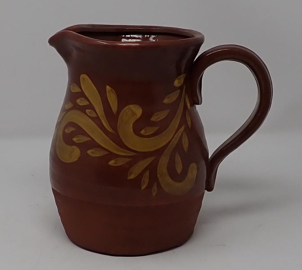 Redware Pitcher: Approx 5 1/2 " in diameter 7 1/2" tall