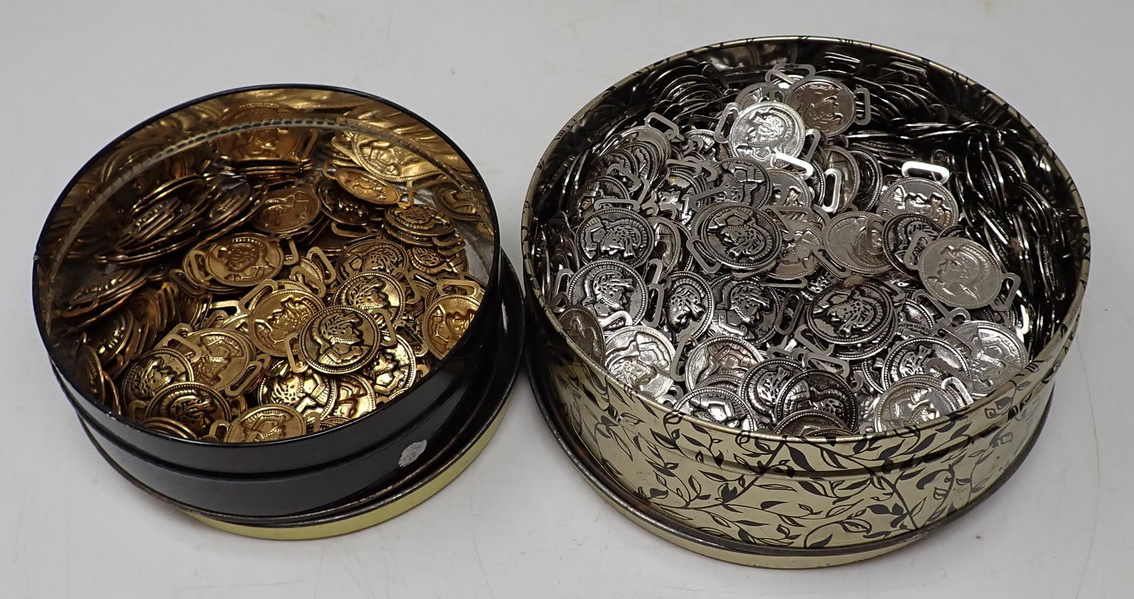 2 Tins Full of NOS Buckles: Approx 1" in diameter.