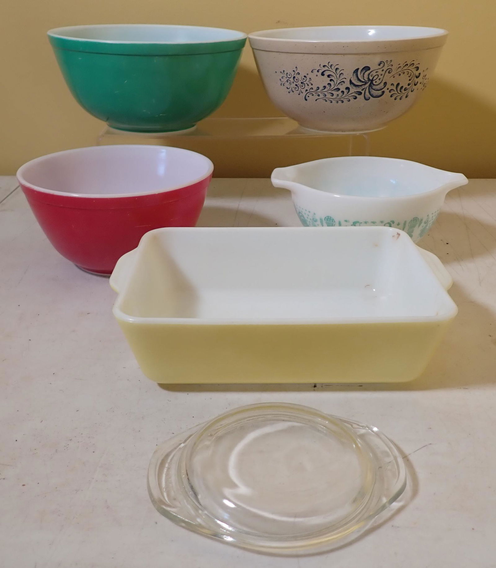 Pyrex Mixing Bowls and Casserole: Green bowl is approx 8 3/4" in diameter and 4" tall.