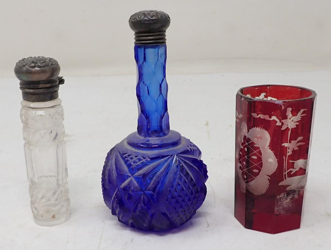 Perfume Bottles w/ Sterling Silver Top: Blue perfume top is marked sterling. Bottle is approx 2" in diameter and 3 3/4" tall. Clear bottle is not marked sterling or guaranteed.
