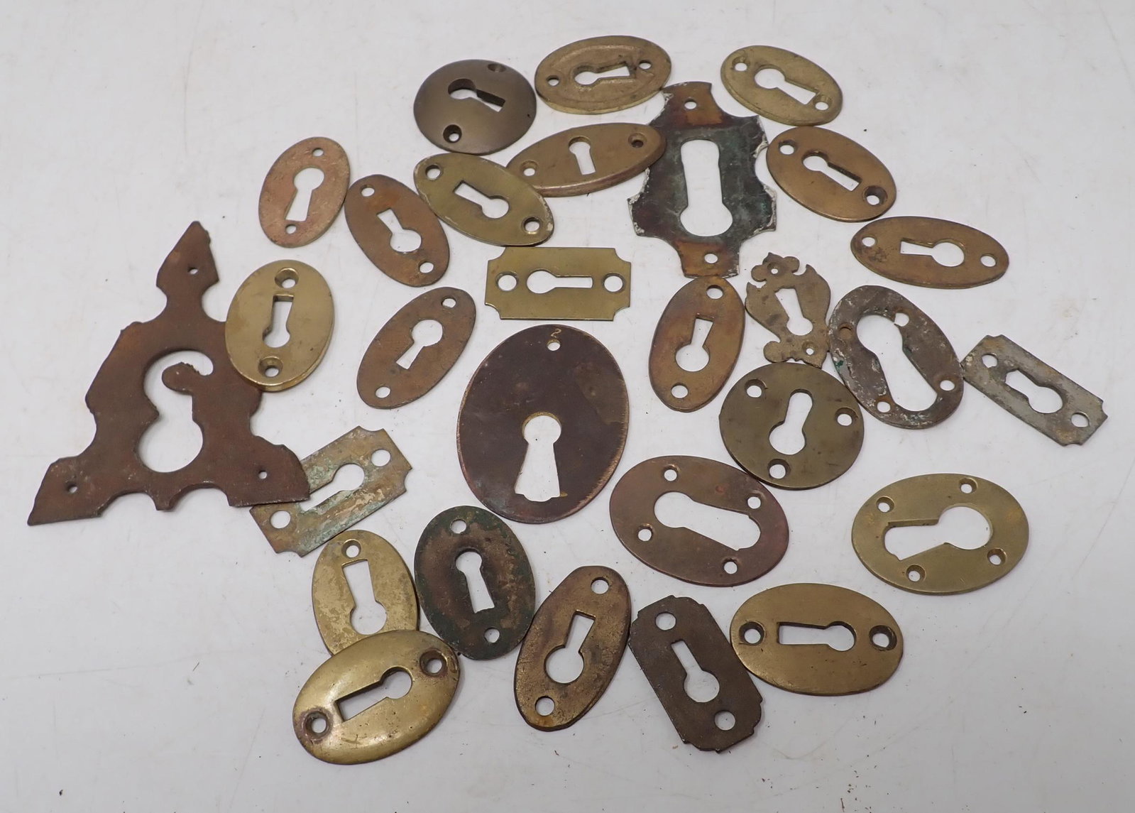 Brass Escutcheons: Most are brass. Largest is appx 3" x 3 3/4" ( and is not brass).