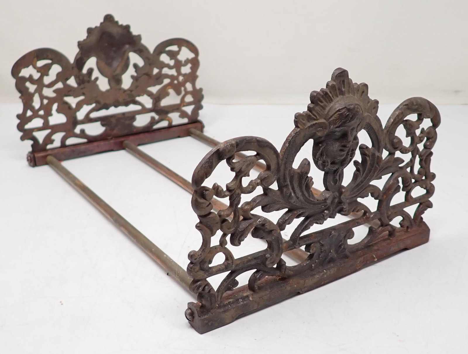 Cast Iron Book Rack: Approx 8" wide, 5" tall, 13" long ( all the way in ) , 23" long extended.