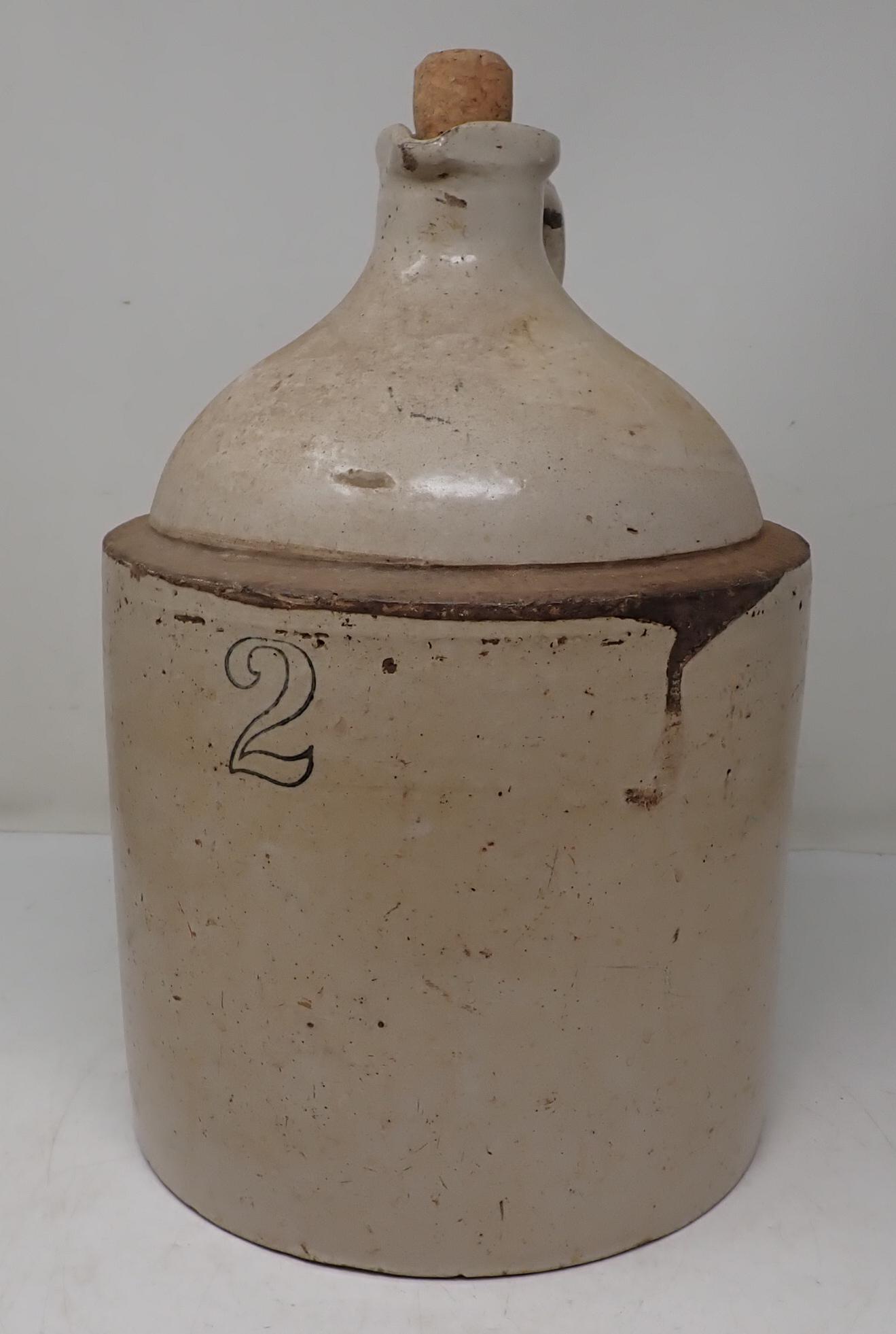 2 Gallon Stoneware Crock: Approx 9" in diameter and 13 3/4" tall. Has a "B" stamped on back.