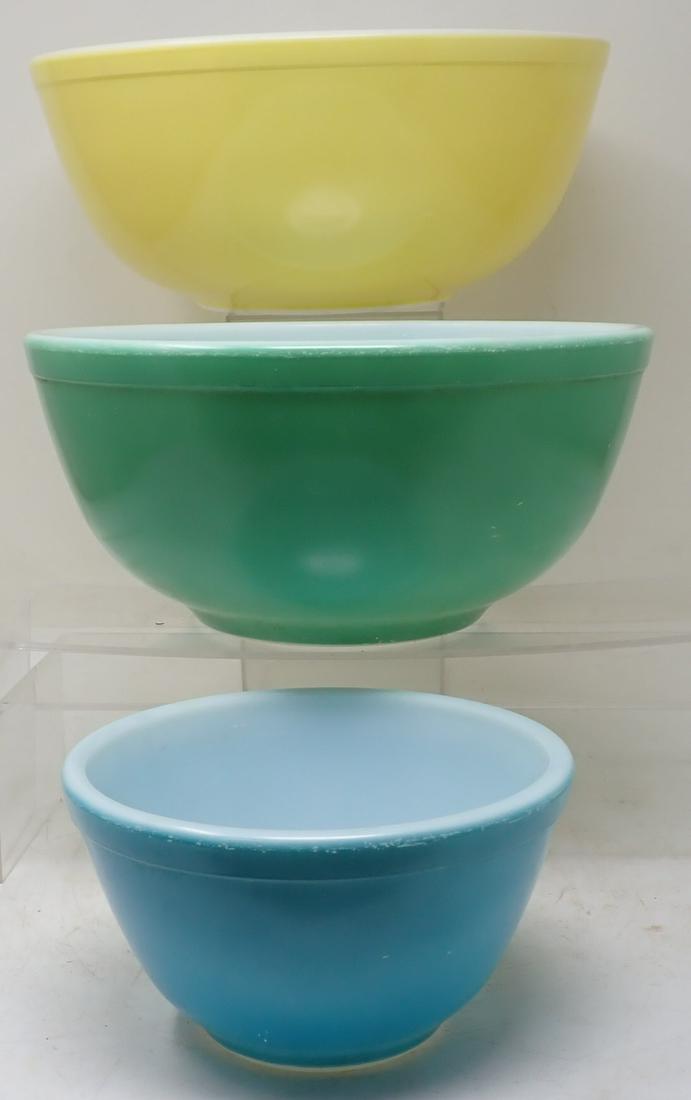Pyrex Mixing Bowls: Largest is apprx 10 1/2" in diameter and 4 1/2" tall.